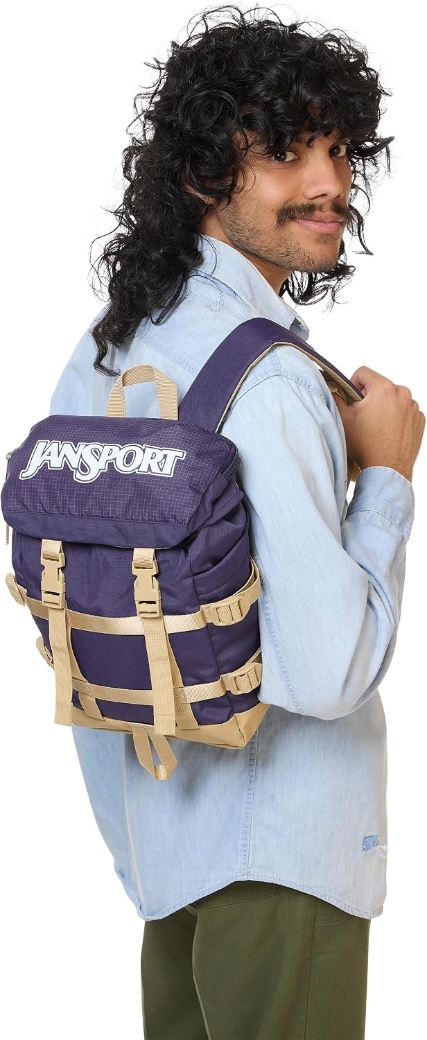 image:imageJanSport Mini Skip Pack Compact Backpack with Main Compartment Side Water Bottle Pocket and Zippered Accessory Pocket Red TapeAmethyst Angst