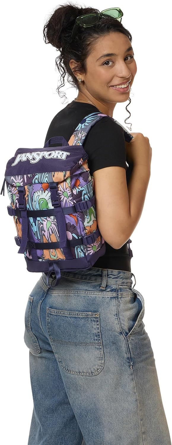 image:imageJanSport Mini Skip Pack Compact Backpack with Main Compartment Side Water Bottle Pocket and Zippered Accessory Pocket Red TapeMelted Blooms Yellow