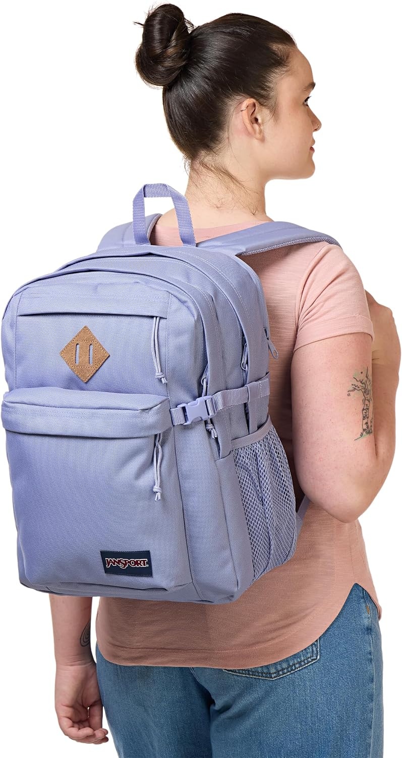 image:imageJanSport Main Campus Backpack Travel or Work Backpack with 15Inch Laptop Sleeve and Dual Water Bottle Pockets Lavender AshLavender Ash